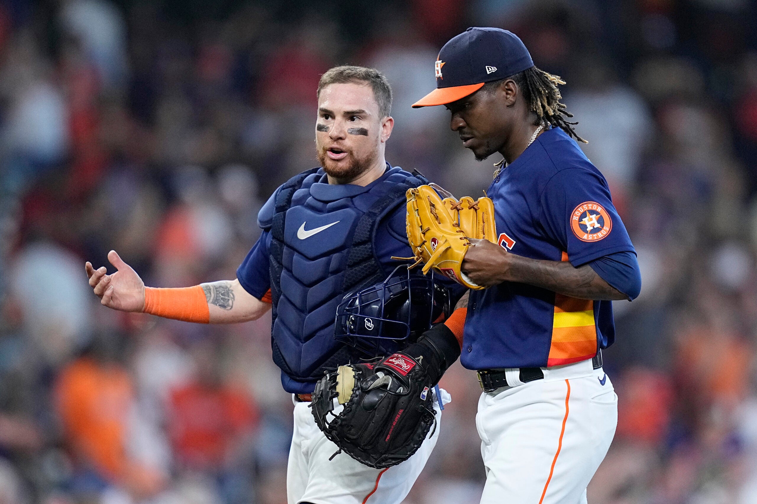 Houston's Christian Vázquez talks to relief pitcher Rafael Montero