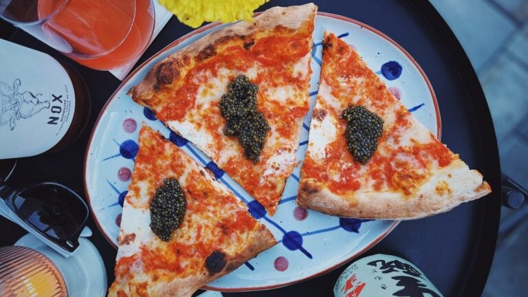 Pizza Project slices draped in caviar at Super Club at The Speedway