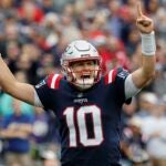 New England Patriots quarterback Mac Jones celebrates a touchdown against the Baltimore Ravens Sunday, Sept. 24, 2022 in Foxborough, Mass.