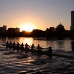 Harvard-Radcliffe Women's Heavyweight Crew team train on the Charles River