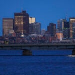 The Mass Avenue Bridge and the Boston skyline at dusk