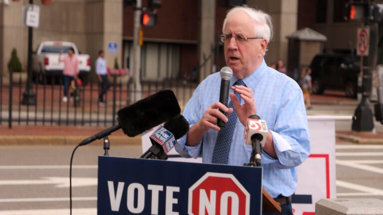 Jim Lyons, chairman of the Massachusetts Republican Party, speaks at a rally in Boston in August.