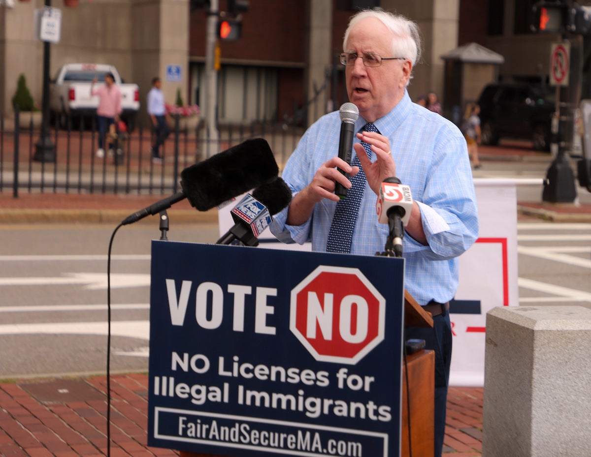Jim Lyons, chairman of the Massachusetts Republican Party, speaks at a rally in Boston in August.