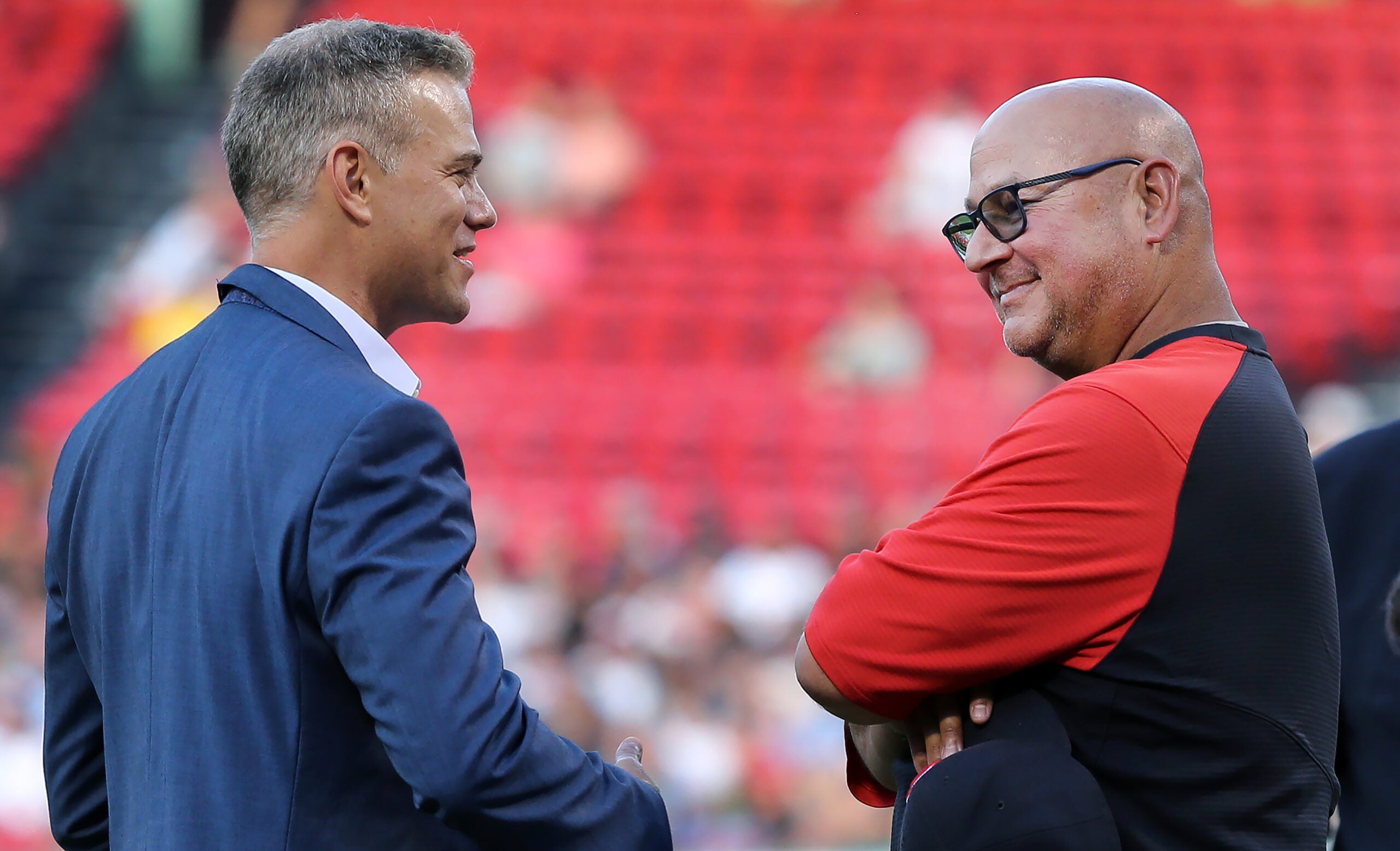 Theo Epstein and Terry Francona exchange smiles as they talk prior to David Ortiz's Hall of Fame celebration at Fenway Park.