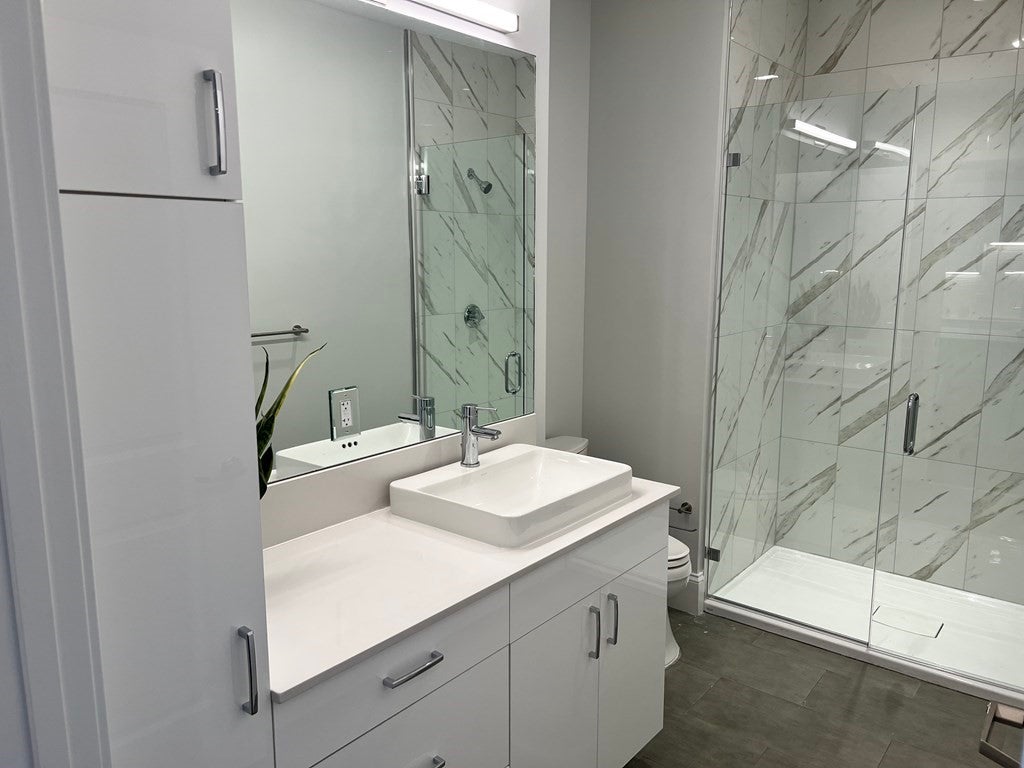 205 Maverick St bathroom with single sink and shower. 
