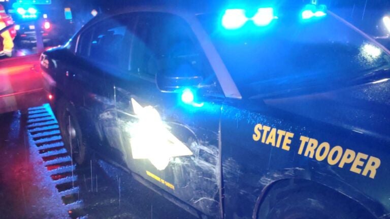 alt = a New Hampshire State Trooper's cruiser sustained cosmetic damage to its passenger side when it was used to stop a wrong-way driver on I-95 in New Hampshire.
