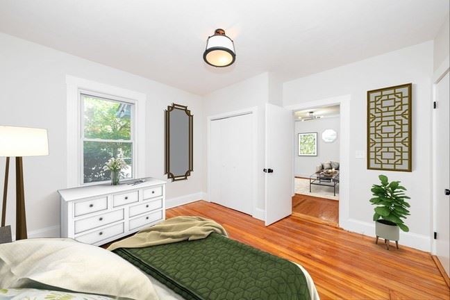 32 Turner Street bedroom virtually staged, with window on the far left side of the room. 