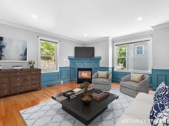 41 Columbus Avenue living room with fireplaces and wainscoting. 