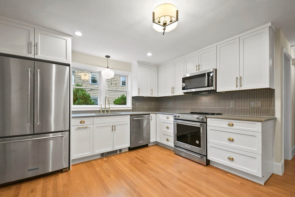 74 Upham St. open kitchen with window and ample storage. 