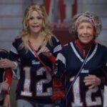 (L to R) Rita Moreno, Jane Fonda, Lily Tomlin, and Sally Field walk through a stadium tunnel wearing Patriots jerseys in '80 For Brady,' the upcoming Tom Brady movie.