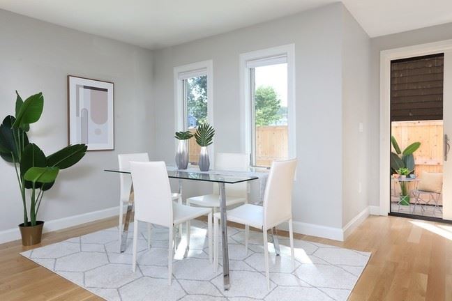 90 Holworthy St Cambridge Dining Room with ample light and a four top table in the center of the space. 