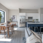 Kitchen, eating area and living room all in an East Boston apartment. Modern features and light soak up the space.