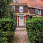 65 Woodbine St exterior with walkway leading to the front door, and steps to get into the front door.