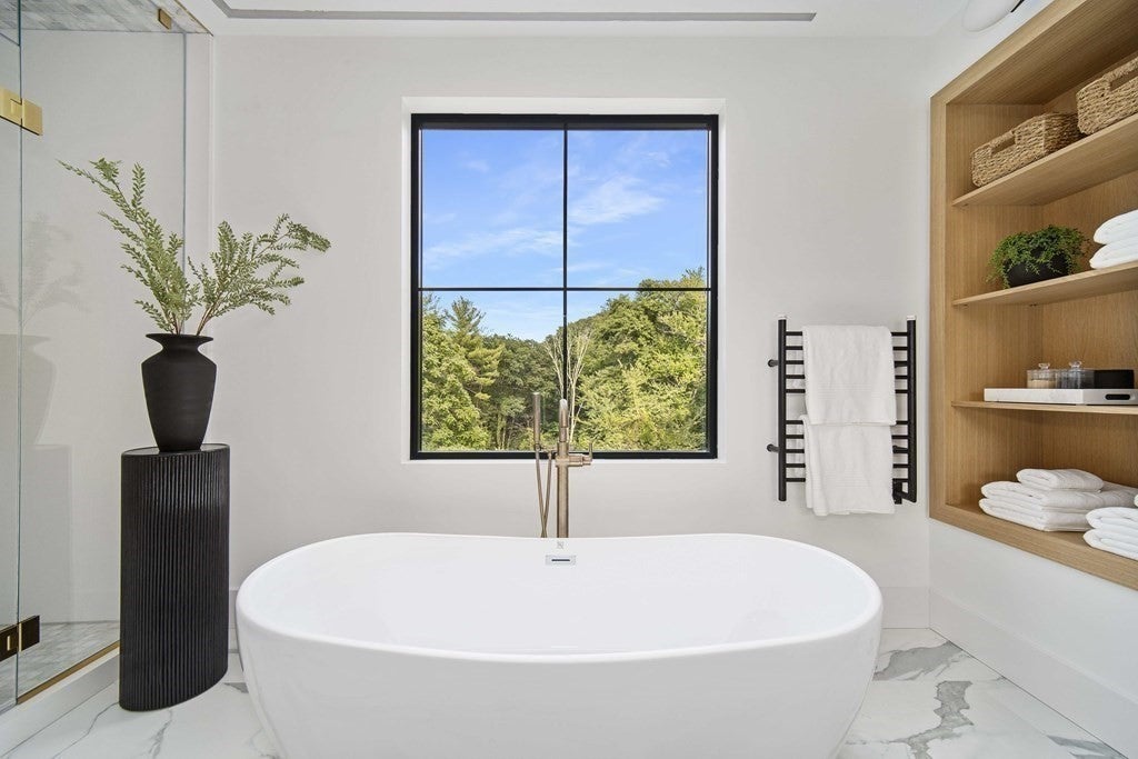 21 Plain Rd bath tub under a square window.