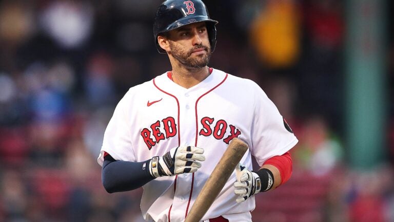 J.D. Martinez of the Boston Red Sox is pushed in a laundry cart