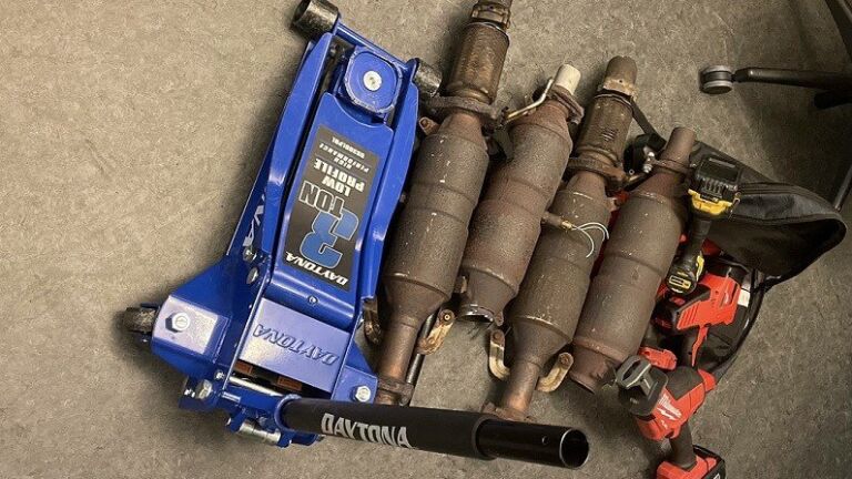 alt = four catalytic converters, a blue jack, and a power tool recovered by Boston police in Roxbury
