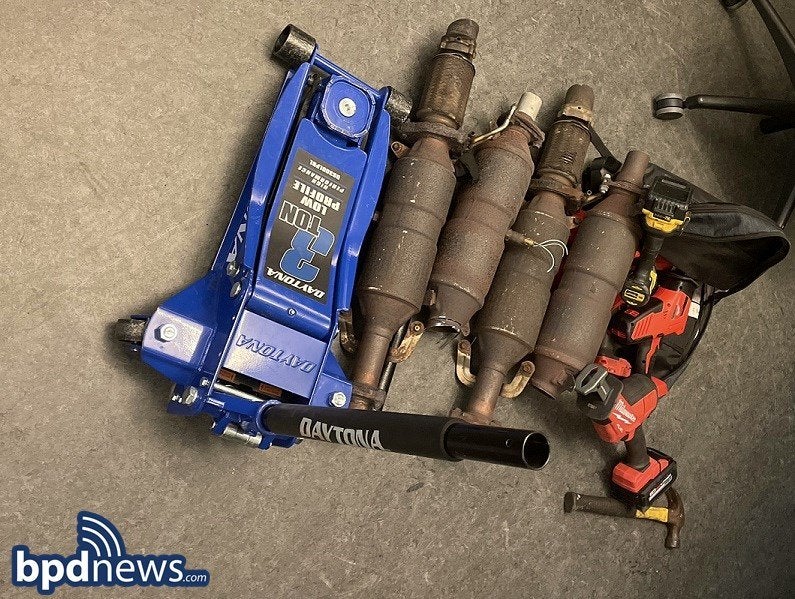 alt = four catalytic converters, a blue jack, and a power tool recovered by Boston police in Roxbury