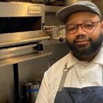 Chef Matthew Bullock poses in the kitchen at Forage in Cambridge, where he'll launch Southern Pines Supper Club pop-up.