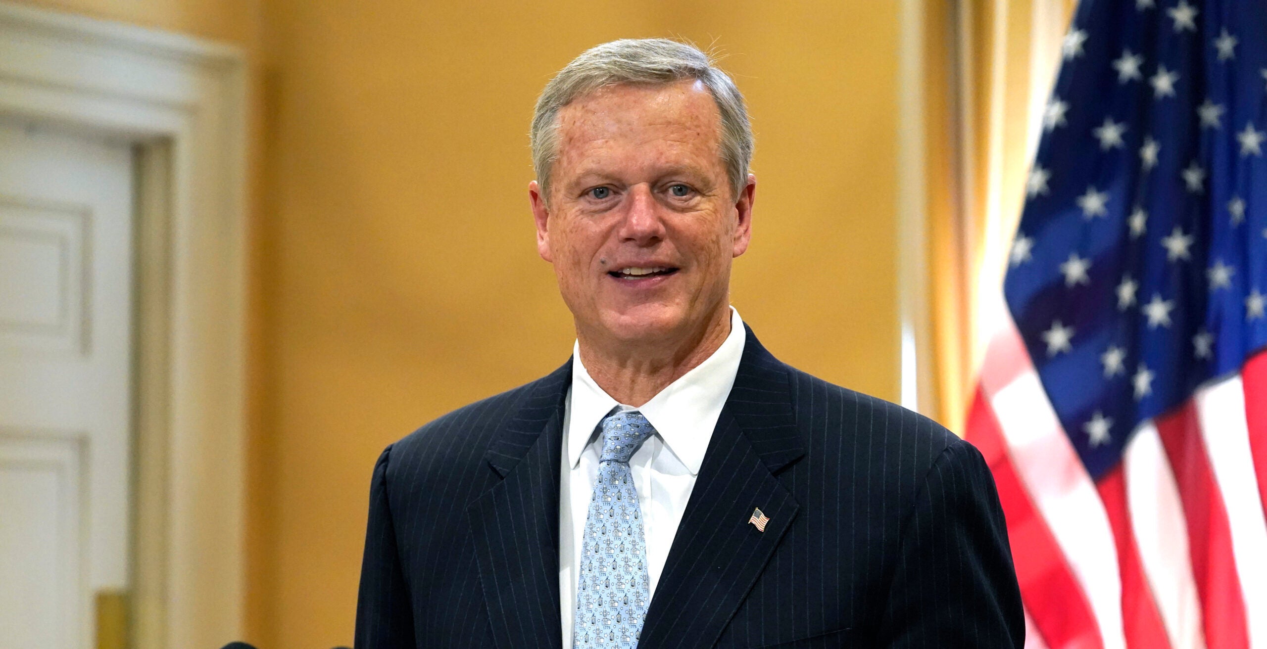 Gov. Charlie Baker speaks with reporters during a news conference Nov. 9 at the State House in Boston.