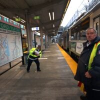 T employees at the new Medford/Tufts Green Line station doing some checks before opening day.
