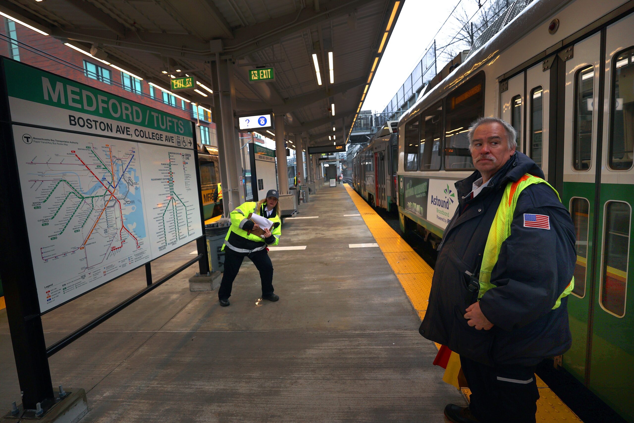 T employees at the new Medford/Tufts Green Line station doing some checks before opening day.