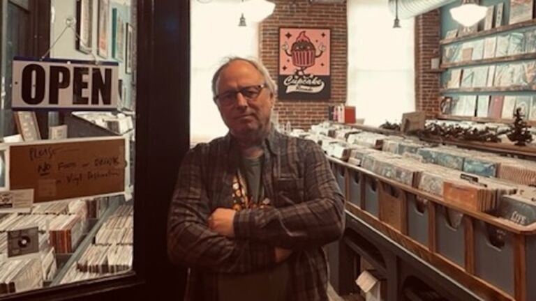 Dave Perry stands in his record store, Vinyl Destination, in Lowell.