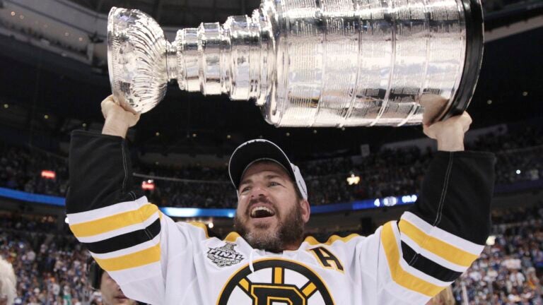 The Stanley Cup in a Pool, From L to R Mark Recchi, Rod Bri…