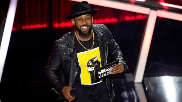 Stephen "tWitch" Boss presents the award for top Latin artist at the Billboard Music Awards in Los Angeles on Oct. 14, 2020.