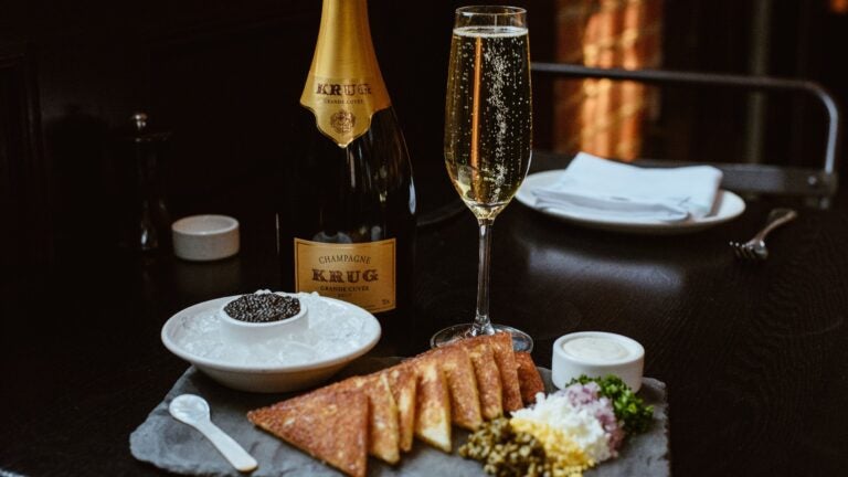 A stylised photo of Row 34's New Year's Eve tradition of caviar and Krug