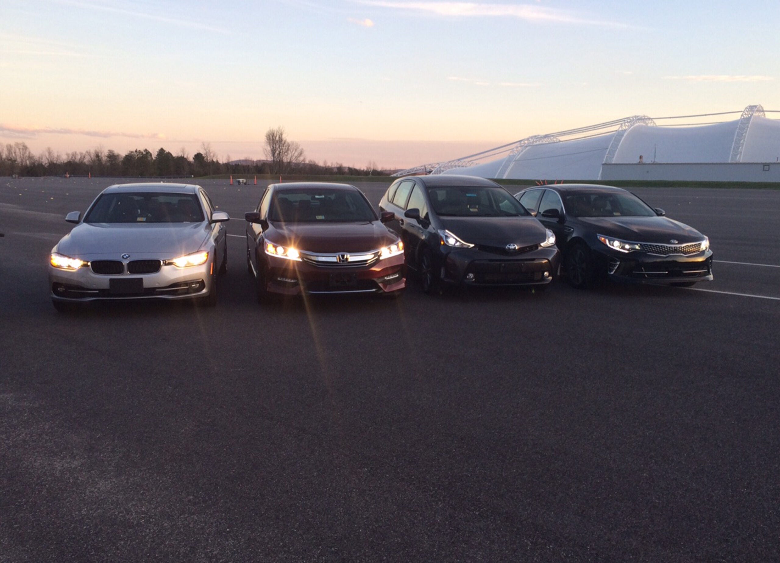 EMBARGOED UNTIL 12:01 A.M., WEDNESDAY, MARCH 30, 2016 - In this photo provided by the The Insurance Institute for Highway Safety, from left, a BMW 3 series, Honda Accord, Toyota Prius V and a Kia Optima are seen at the institutes Vehicle Research Center in Ruckersville, Va. A new study that rates the headlights of more than 30 midsized car models found only one model earned a good rating. Of the rest, half were rated acceptable and half were rated poor. The difference between the top-rated and bottom-rated model in terms of a drivers ability to see down a dark road was substantial. (Russ Rader/Insurance Institute for Highway Safety via AP)