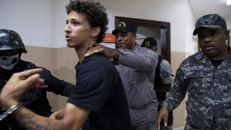 Rolfi Ferreyra Cruz, the alleged shooter, is taken to court by the police in Santo Domingo, Dominican Republic, in June 2019.