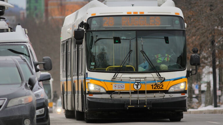 Boston, MA - 03/01/22 - A 28 bus heads inbound to Ruggles Station on Blue Hill Avenue. Riders took advantage of the start of a new two-year program that makes MBTA bus lines 23, 28, and 29 all free of charge. (Lane Turner/Globe Staff) Reporter: (Taylor Dolven) Topic: (02wu)