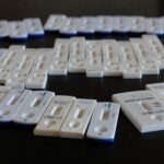 alt = COVID-19 Antigen rapid tests, both negative and some positive, made and collected by one person over 18 months of the coronavirus COVID-19 pandemic.