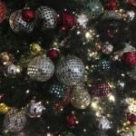 ornaments hang on a Christmas tree