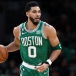 Jayson Tatum #0 of the Boston Celtics dribbles downcourt during the first half against the Golden State Warriors at TD Garden on January 19, 2023 in Boston, Massachusetts.