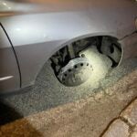 alt = Whitman police pulled over driver who was allegedly intoxicated and operating a vehicle with a missing front passenger side tire.