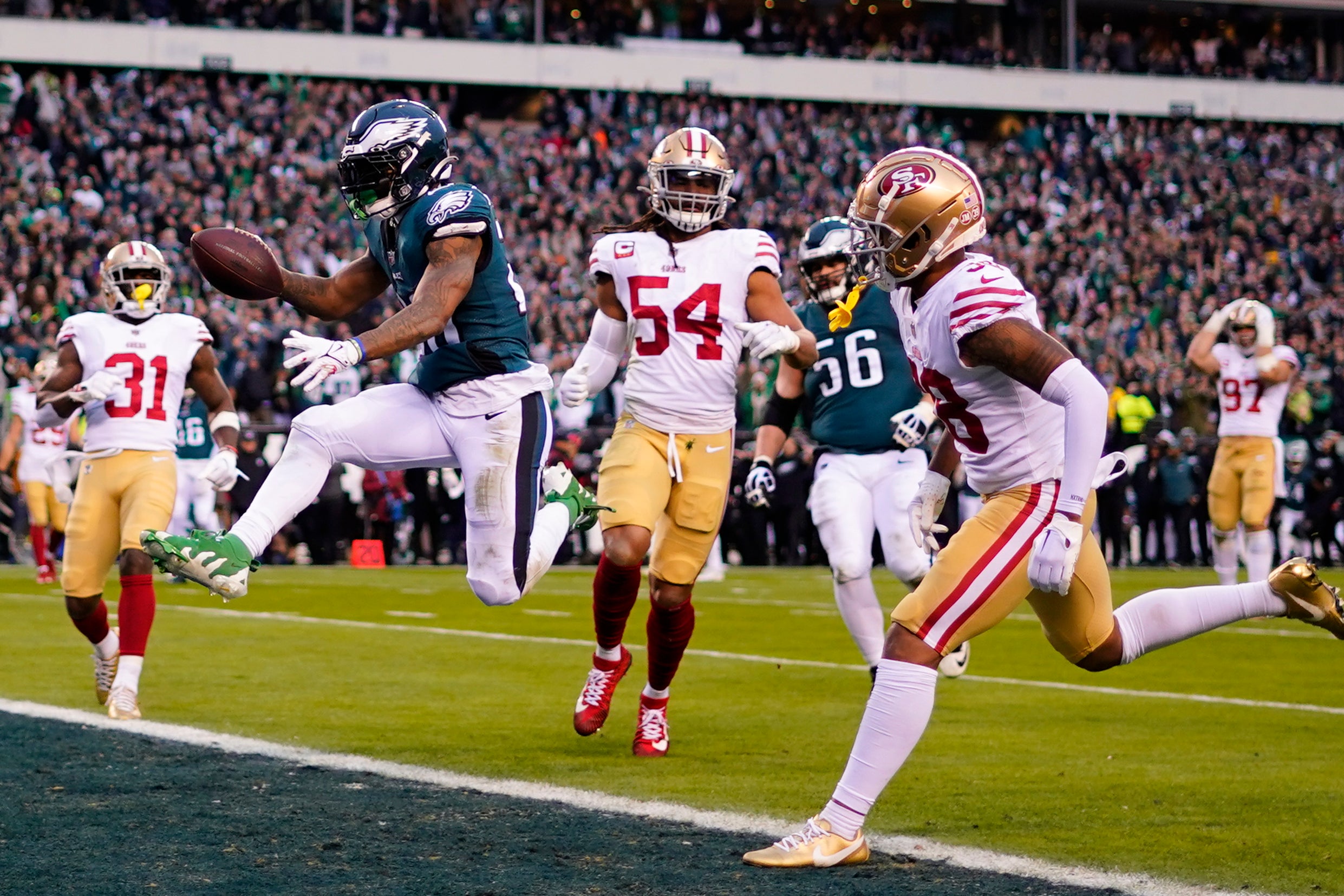 Philadelphia running back Miles Sanders celebrates after scoring during the first half of the NFC Championship game between the Eagles and the San Francisco 49ers in Philadelphia.