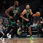 Jayson Tatum #0 of the Boston Celtics dribbles downcourt next to Jaylen Brown #7 during the first half of the game against the Cleveland Cavaliers at TD Garden on October 28, 2022 in Boston, Massachusetts.