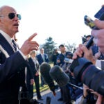 President Joe Biden talks with reporters on the South Lawn of the White House in Washington, Monday, Jan. 30, 2023, after returning from an event in Baltimore on infrastructure. (AP Photo/Susan Walsh)