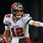 Tampa Bay Buccaneers quarterback Tom Brady (12) points during the first half of an NFL football game against the Atlanta Falcons, Sunday, Jan. 8, 2023, in Atlanta. The Atlanta Falcons won 30-17.
