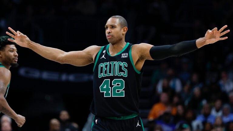 Boston Celtics center Al Horford reacts after the Celtics made a 3-pointer during the second half of an NBA basketball game against the Charlotte Hornets in Charlotte, N.C., Monday, Jan. 16, 2023. Boston won 130-118.