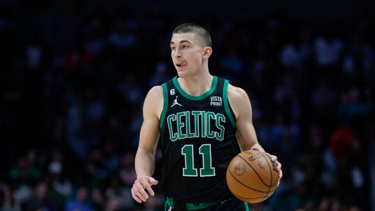 Boston Celtics guard Payton Pritchard brings the ball up court during the second half of an NBA basketball game against the Charlotte Hornets in Charlotte, N.C., Monday, Jan. 16, 2023.