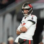 Tampa Bay Buccaneers quarterback Tom Brady (12) waits for his receivers to get into position during pre-game warmups before an NFL wild-card football game against the Dallas Cowboys, Monday, Jan. 16, 2023, in Tampa, Fla.
