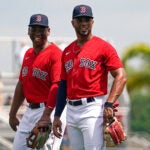 Boston Red Sox shortstop Xander Bogaerts (2) and third baseman Rafael Devers (11) share a laugh. - Red Sox Spring Training - The Boston Red Sox host the Baltimore Orioles at JetBlue Park in Fort Myers, FL.