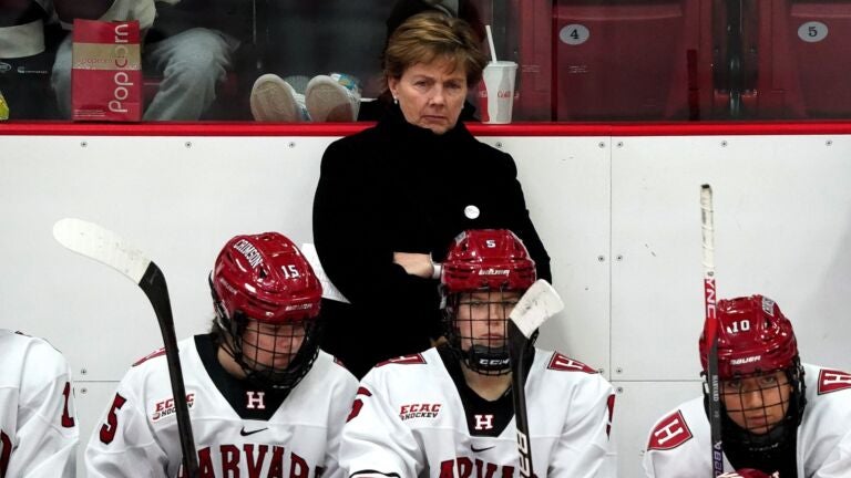 Katey Stone is seen behind the bench in January at Harvard's home arena, the Bright-Landry Center. A review following a tirade during a practice triggered a backlash that continues to reverberate among former players who say Stone has emotionally damaged them.