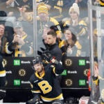 Boston Bruins center David Krejci, right, reacts as he is recognized for playing in his 1000th career game for the Boston Bruins in the first period of an NHL hockey game against the Philadelphia Flyers, Monday, Jan. 16, 2023, in Boston.