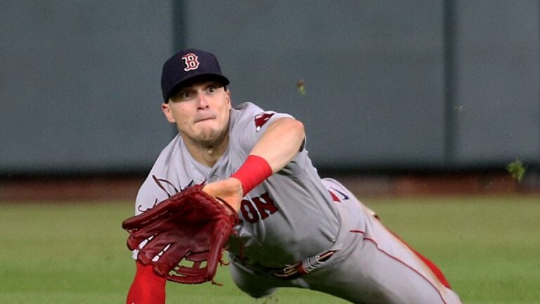 Boston Red Sox's Enrique Hernandez dunks away from a low pitch in the  fourth inning of the team's baseball game against the Cleveland Guardians,  Wednesday, June 7, 2023, in Cleveland. (AP Photo/Sue