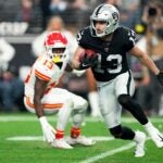 Hunter Renfrow #13 of the Las Vegas Raiders carries the ball \ac at Allegiant Stadium on January 07, 2023 in Las Vegas, Nevada.