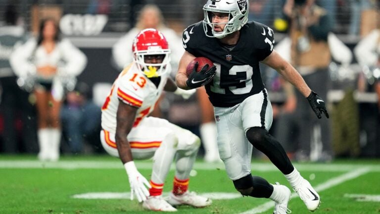 Hunter Renfrow #13 of the Las Vegas Raiders carries the ball \ac at Allegiant Stadium on January 07, 2023 in Las Vegas, Nevada.