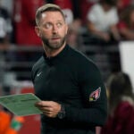 Arizona Cardinals head coach Kliff Kingsbury watches warm ups prior to an NFL football game against the Tampa Bay Buccaneers, Sunday, Dec. 25, 2022, in Glendale, Ariz.